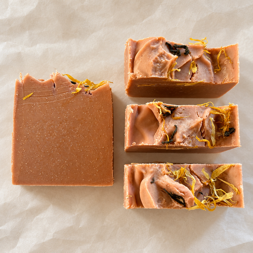 Overhead detail of The Orangery soap bars and botanical tops