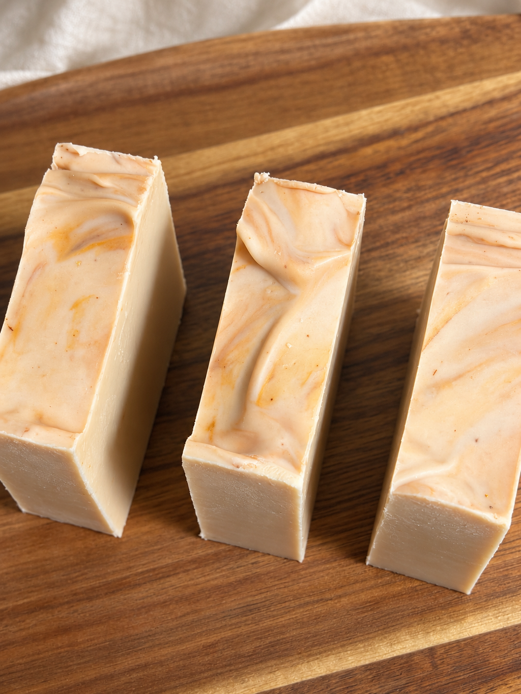 Reading Room handmade honey and beeswax soap bars on a wooden tray