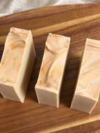 Reading Room handmade honey and beeswax soap bars on a wooden tray